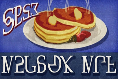 a stack of pancakes with heart-shaped butter and the Simlish language written around it